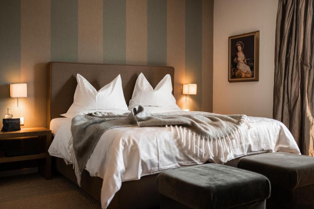 Postel nebo postele na pokoji v ubytování Hotel Chalet Gravenstein