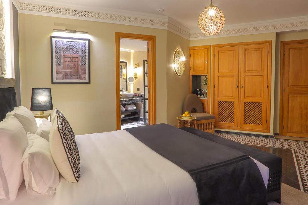 a bedroom with a large white bed in a room at DAR LYS in Fez