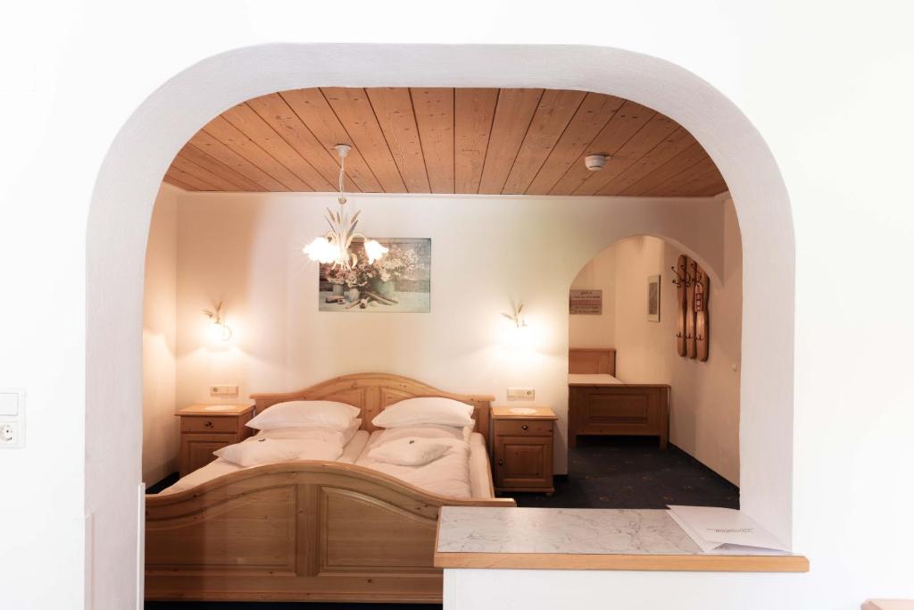 Postel nebo postele na pokoji v ubytování Hotel Rotlechhof
