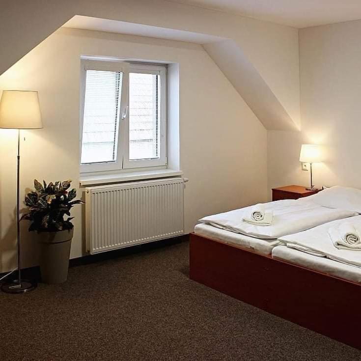 Postel nebo postele na pokoji v ubytování Ubytování u Smrku