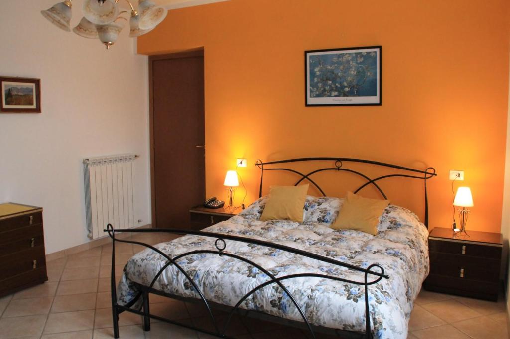 Postel nebo postele na pokoji v ubytování La casetta di Rosa