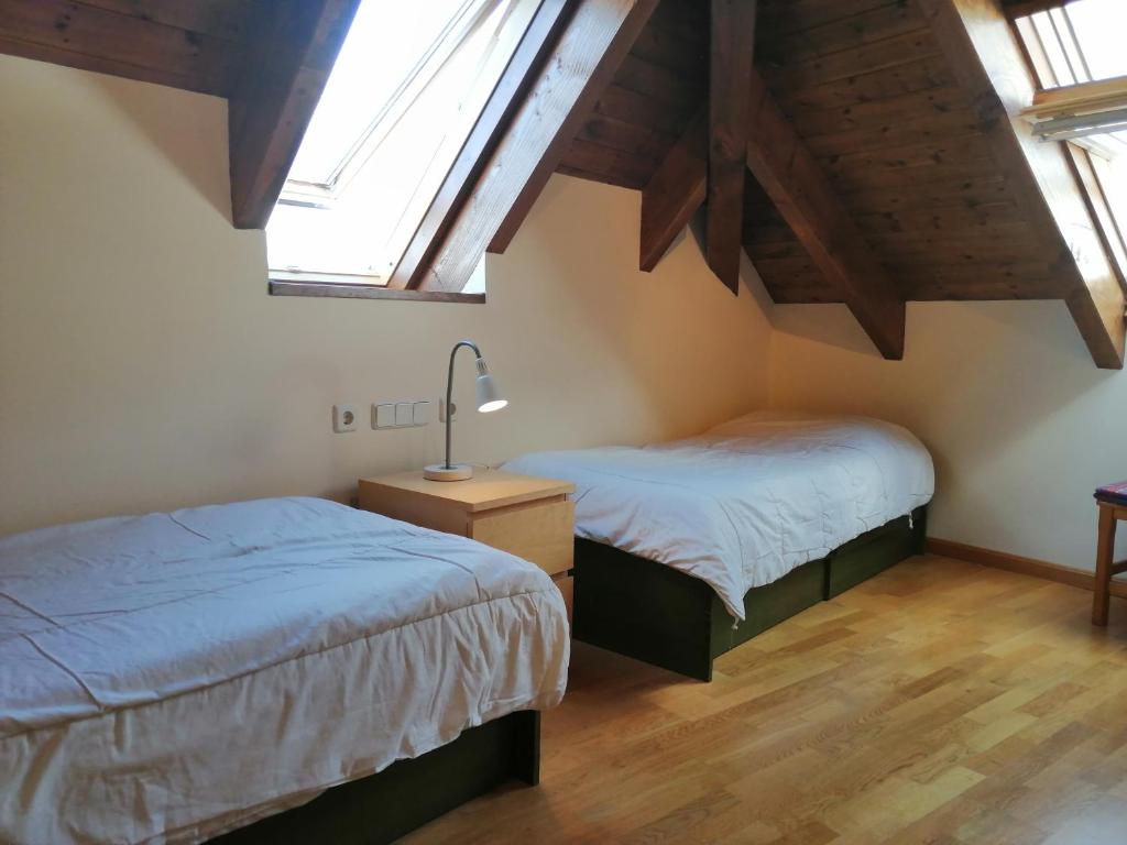 Posteľ alebo postele v izbe v ubytovaní Dúplex con moderna y amplia cocina Erta 6