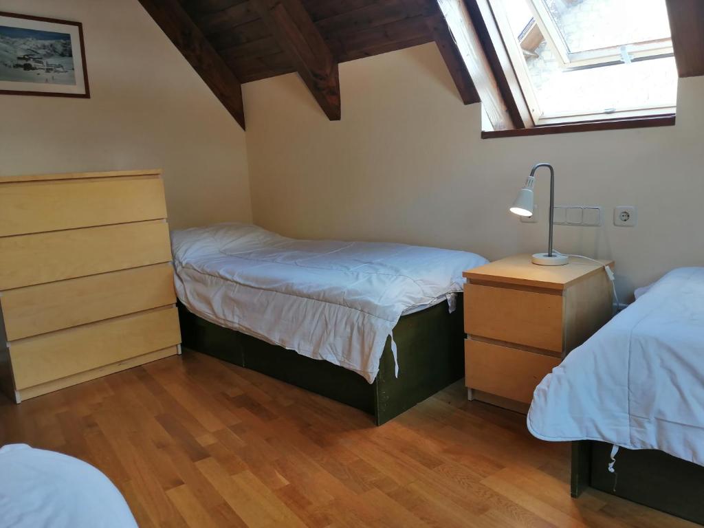 Posteľ alebo postele v izbe v ubytovaní Dúplex con moderna y amplia cocina Erta 6