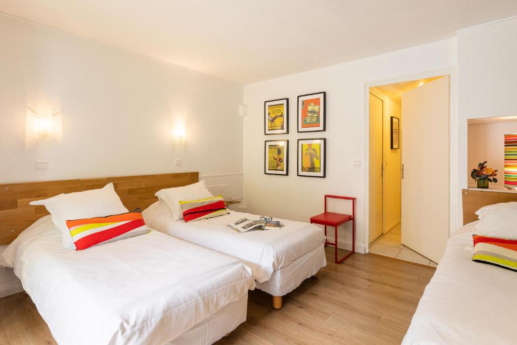 Postel nebo postele na pokoji v ubytování Hôtel Les Hauts de Meursault