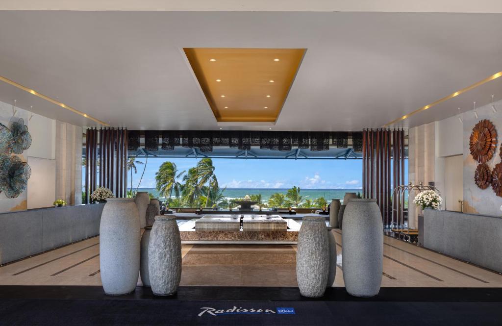 a hotel lobby with a view of the ocean at Radisson Blu Resort Galle in Galle