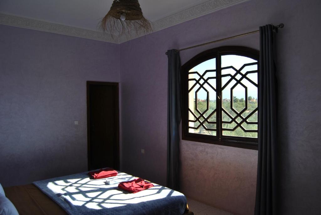 Ein Bett oder Betten in einem Zimmer der Unterkunft Guest House Qodwa