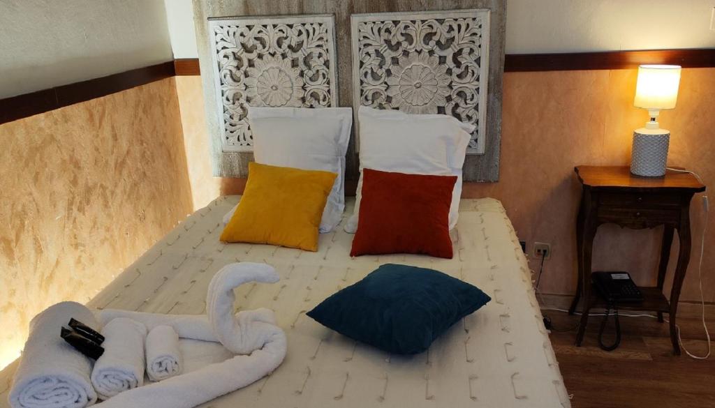 A bed or beds in a room at Hotel San Felice