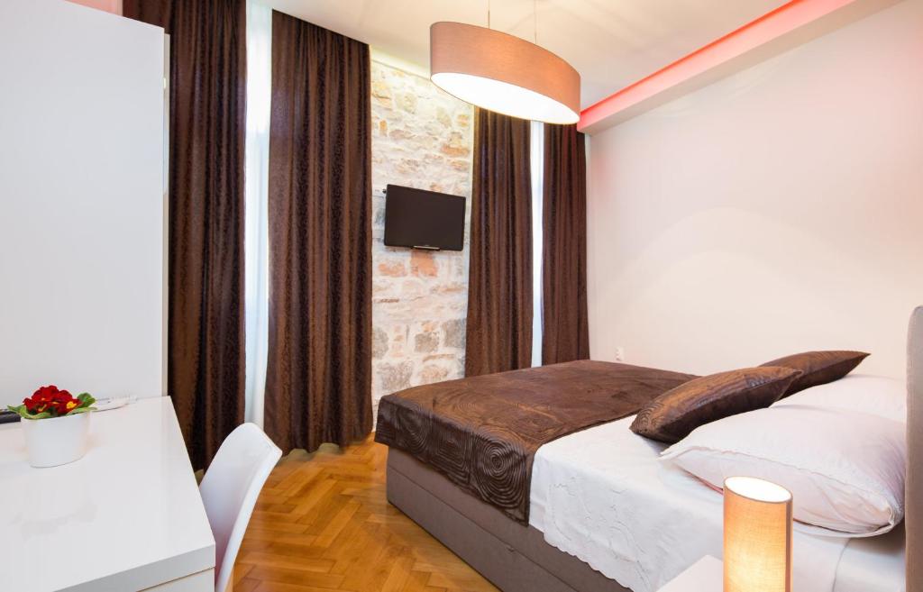 Postel nebo postele na pokoji v ubytování Riva Rooms