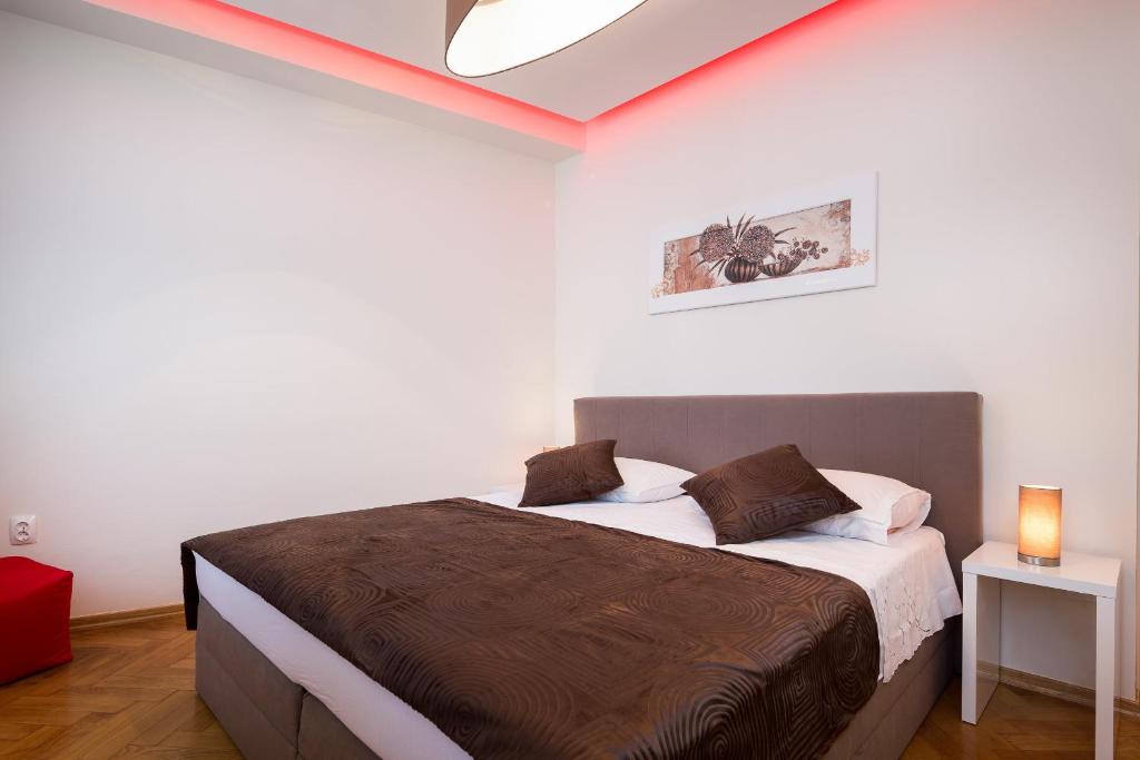 Postel nebo postele na pokoji v ubytování Riva Rooms