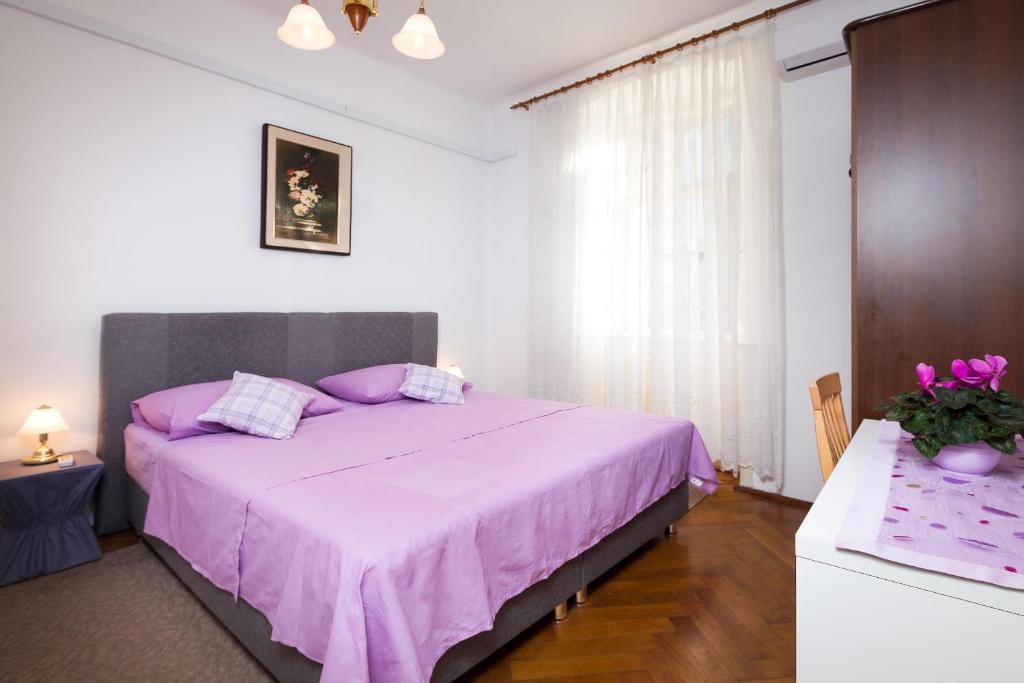 Postel nebo postele na pokoji v ubytování Riva Rooms