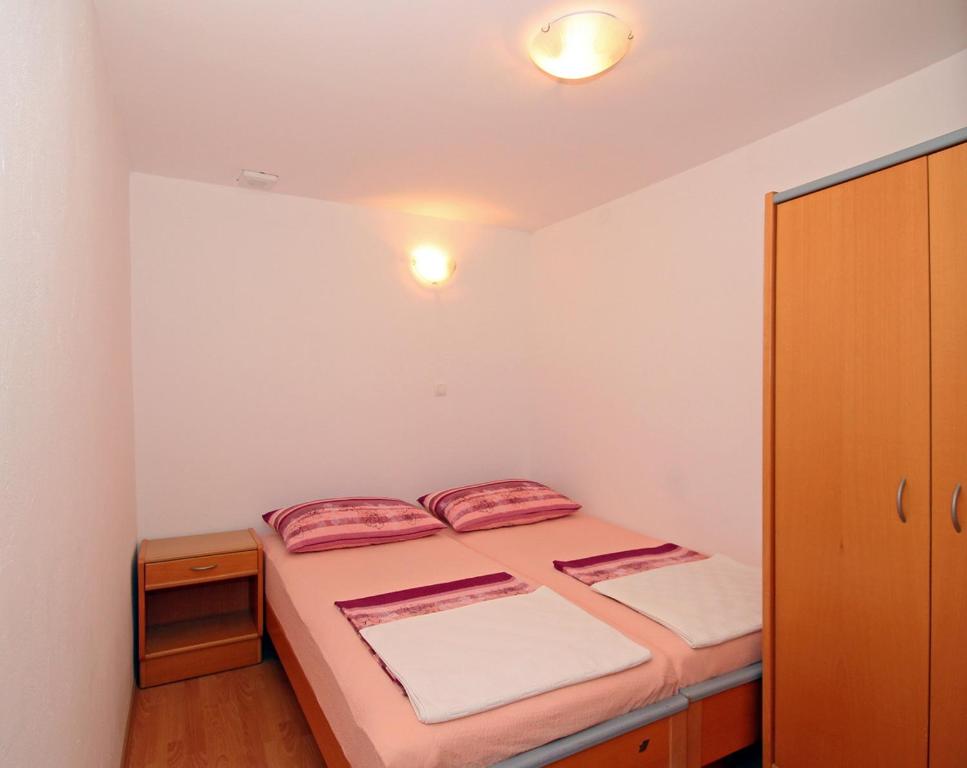 Posteľ alebo postele v izbe v ubytovaní Apartments Near Old Town