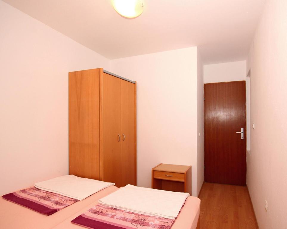 Posteľ alebo postele v izbe v ubytovaní Apartments Near Old Town