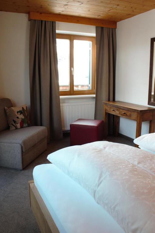 A bed or beds in a room at Haus Biberkopf