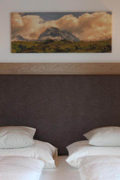 A bed or beds in a room at Haus Biberkopf