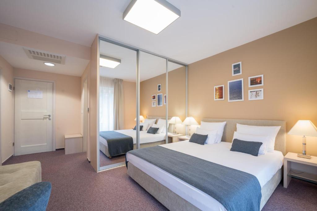 Postel nebo postele na pokoji v ubytování Hotel Zlatna Vala