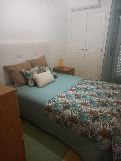 Кровать или кровати в номере Apartamento em Quarteira