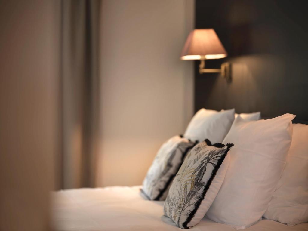 Postel nebo postele na pokoji v ubytování Le 24 Hotel