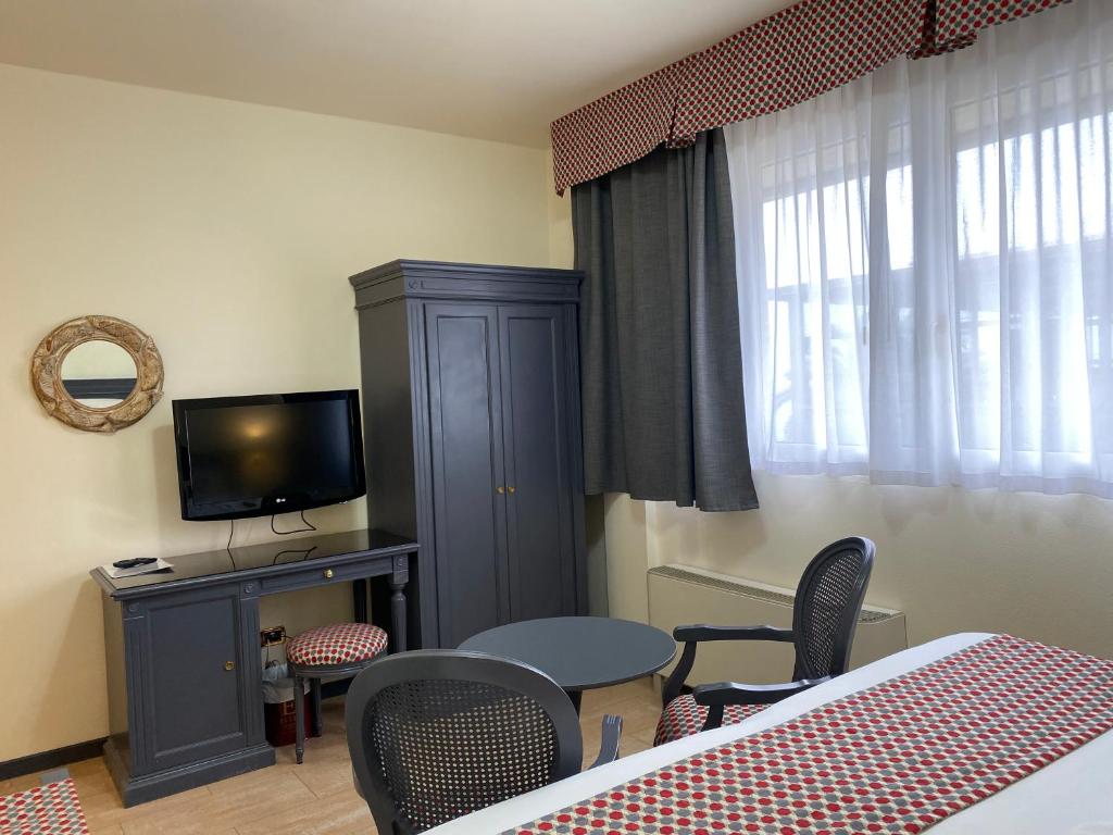 TV a/nebo společenská místnost v ubytování Hotel Estée