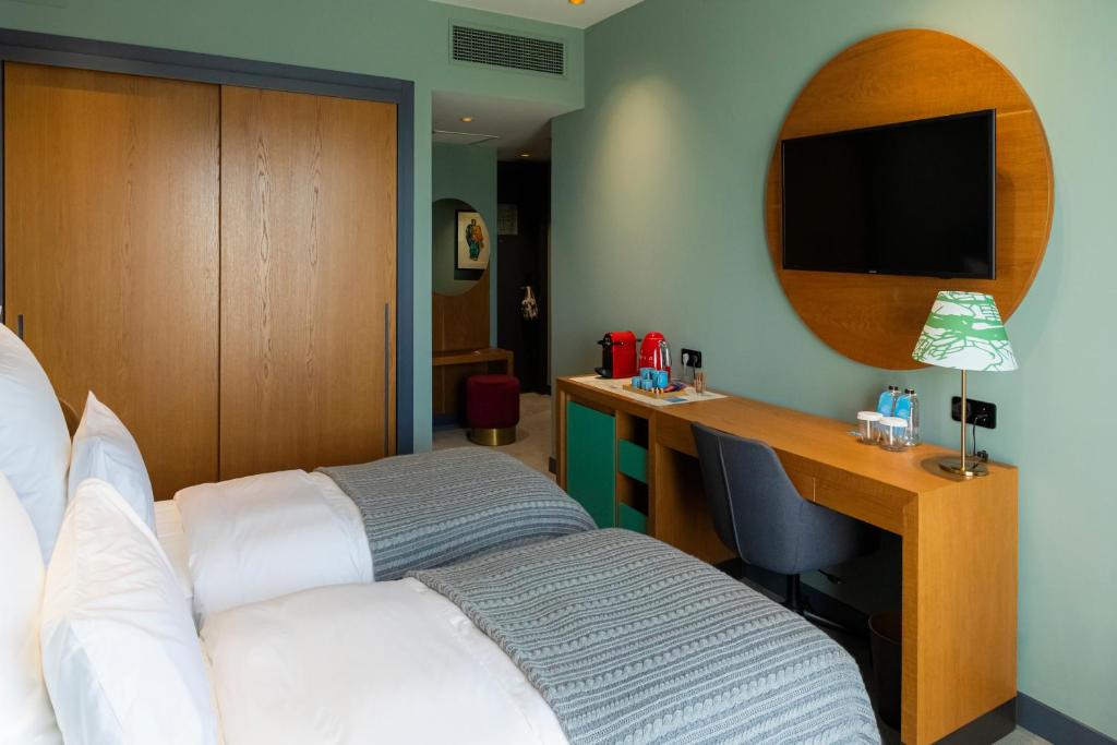 Postel nebo postele na pokoji v ubytování Khedi Hotel Tbilisi