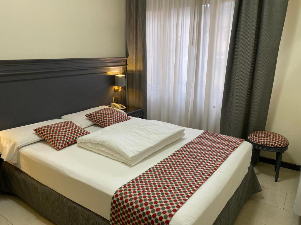 Postel nebo postele na pokoji v ubytování Hotel Estée