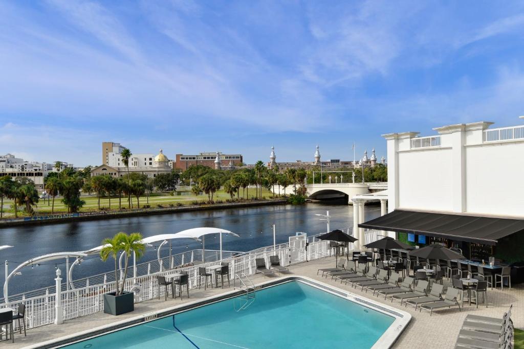 a pool with a view of a river at Hotel Tampa Riverwalk in Tampa