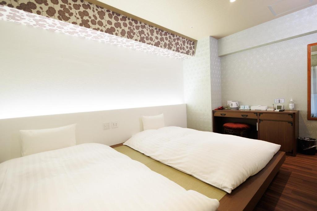 Hotaku HOTEL Akihabaraにあるベッド