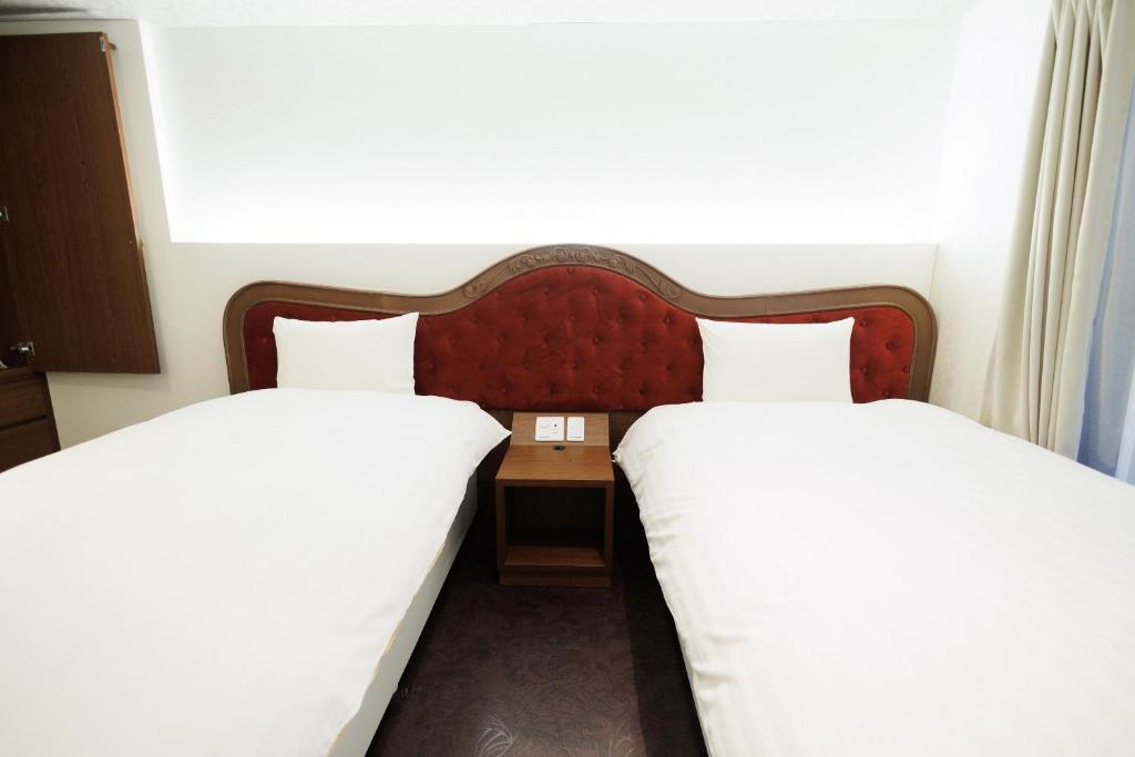 Hotaku HOTEL Akihabaraにあるベッド