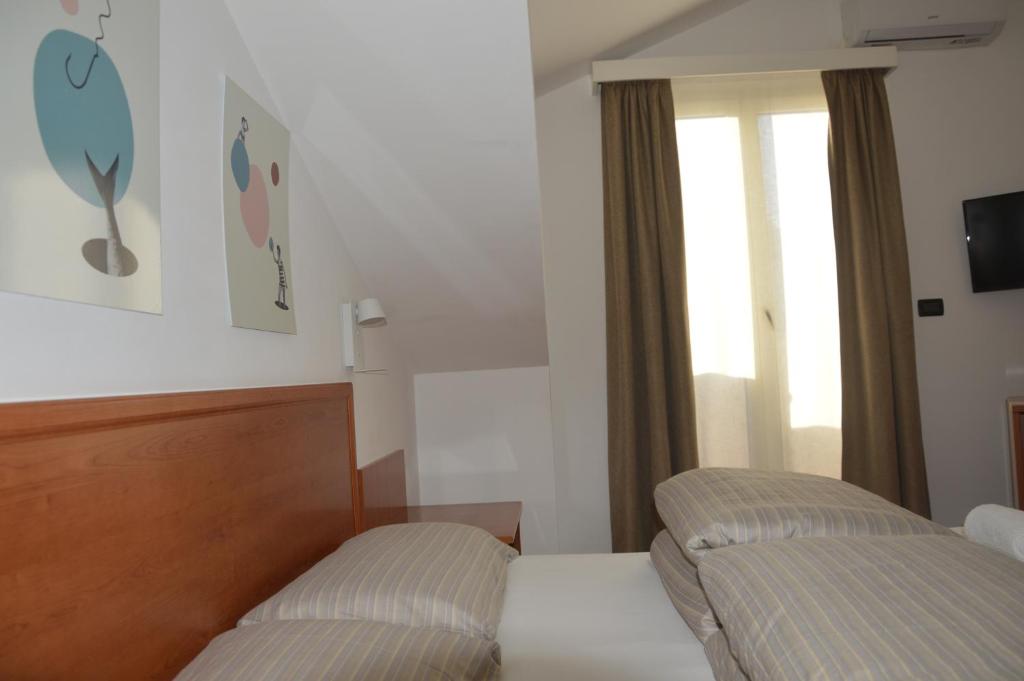 Letto o letti in una camera di Isolabella