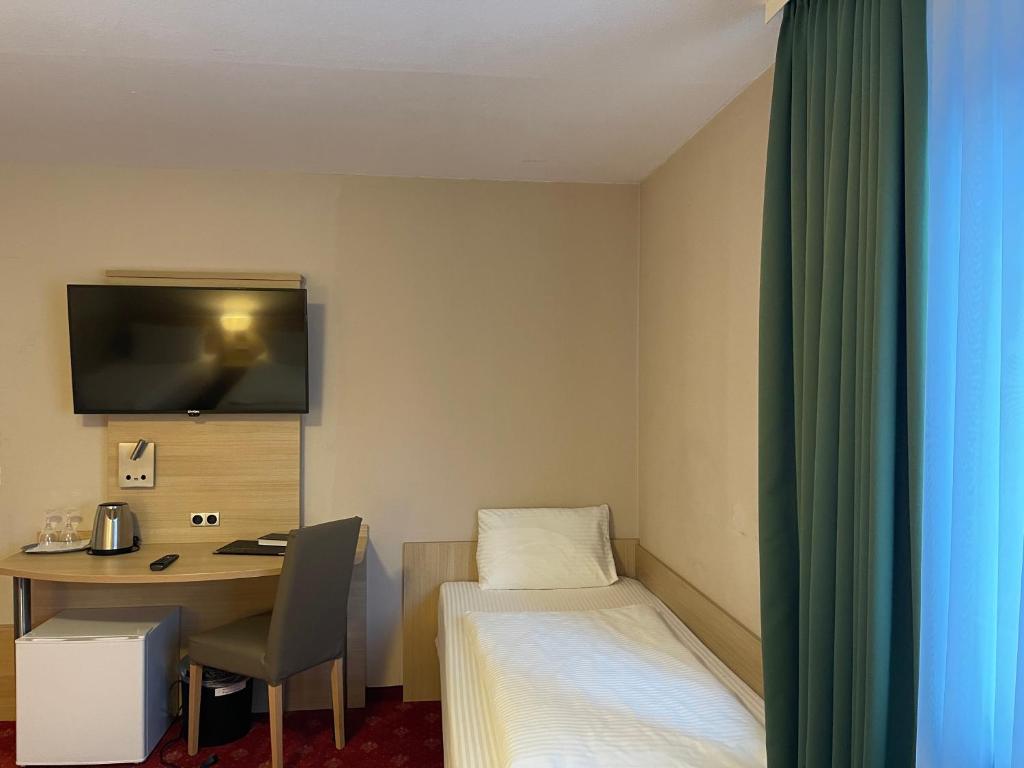 Postel nebo postele na pokoji v ubytování Hafner Hotel Apartment Self Check-In Anytime