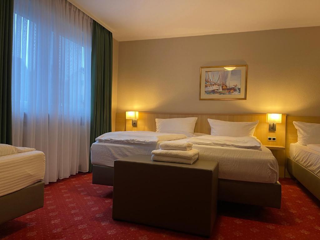 Postel nebo postele na pokoji v ubytování Hafner Hotel Apartment Self Check-In Anytime