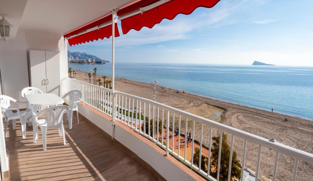 a balcony with a view of the beach at BeniBeachHouse in Benidorm
