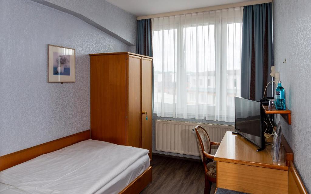 Postel nebo postele na pokoji v ubytování Trip Inn Aschaffenburger Hof