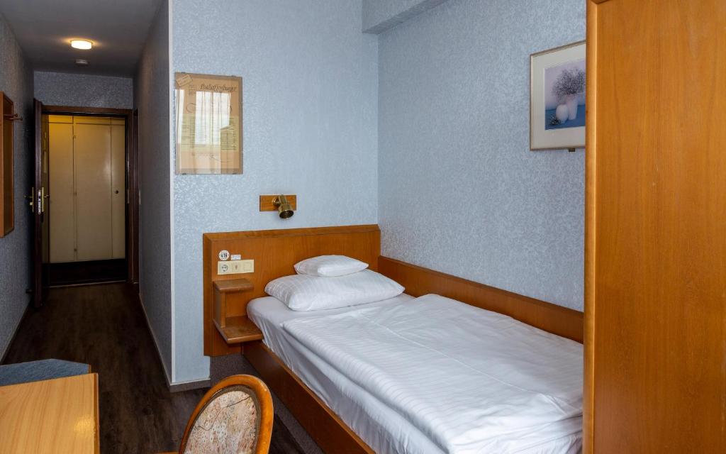 Postel nebo postele na pokoji v ubytování Trip Inn Aschaffenburger Hof