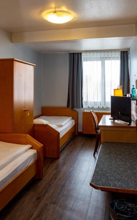 Postel nebo postele na pokoji v ubytování Trip Inn Aschaffenburger Hof