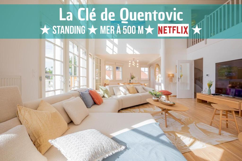 a living room with a couch and a table at La Clé de Quentovic ◎ Duplex de 150 m2 ◎ Standing in Le Touquet-Paris-Plage