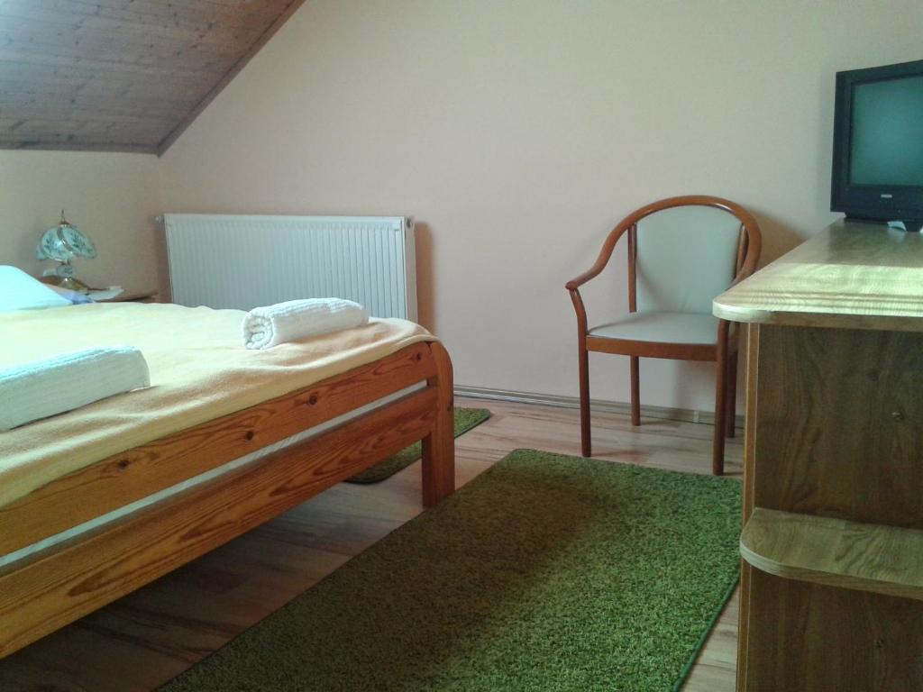 Postel nebo postele na pokoji v ubytování Bundics Vendégházak