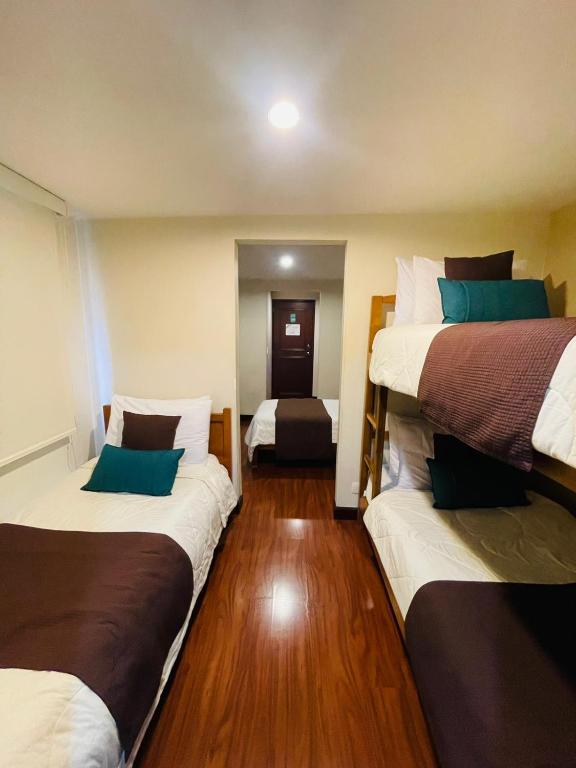 Postel nebo postele na pokoji v ubytování Hotel La Sabana