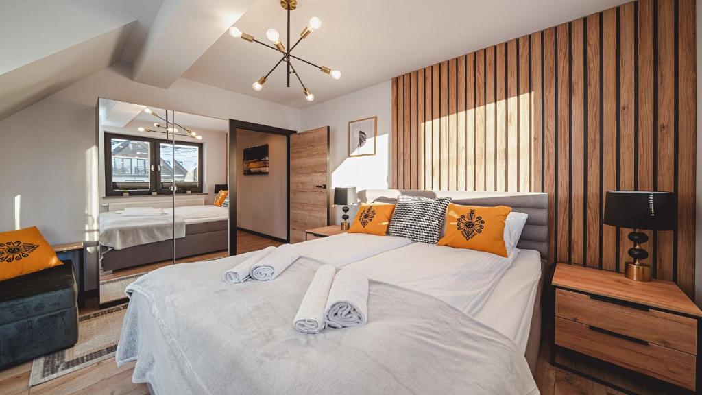 Posteľ alebo postele v izbe v ubytovaní Apartamenty Sun & Snow Resorts C Białka Tatrzańska z sauną