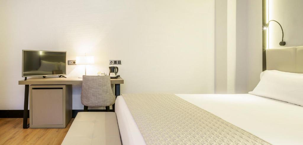 Postel nebo postele na pokoji v ubytování Hotel Ilunion Bilbao