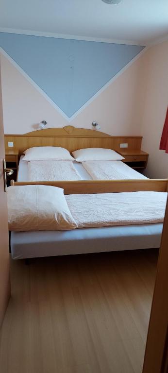 Postelja oz. postelje v sobi nastanitve Pension Koderholt