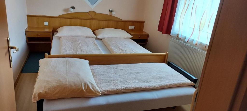 Postelja oz. postelje v sobi nastanitve Pension Koderholt