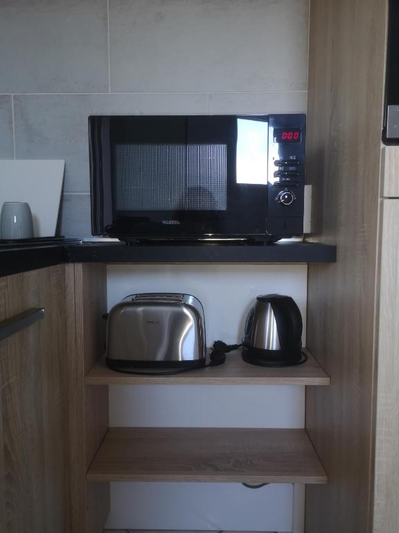 Kuchyňa alebo kuchynka v ubytovaní Spacieux T2 53 m2 Aix-Parc Lac 4*