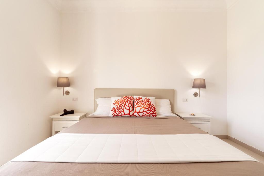 Postel nebo postele na pokoji v ubytování Victoria Palace Hotel & Zen Wellness