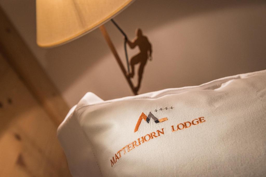 a picture of a man on top of a pillow at Matterhorn Lodge Boutique Hotel & Apartments in Zermatt