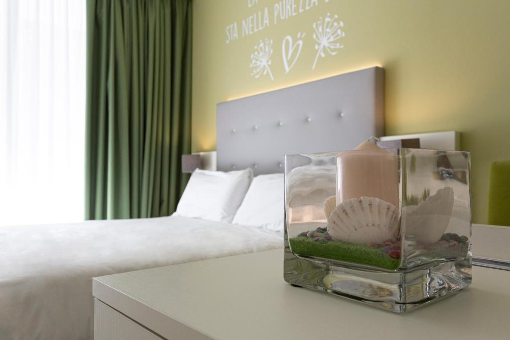 Кровать или кровати в номере Hotel Amburgo