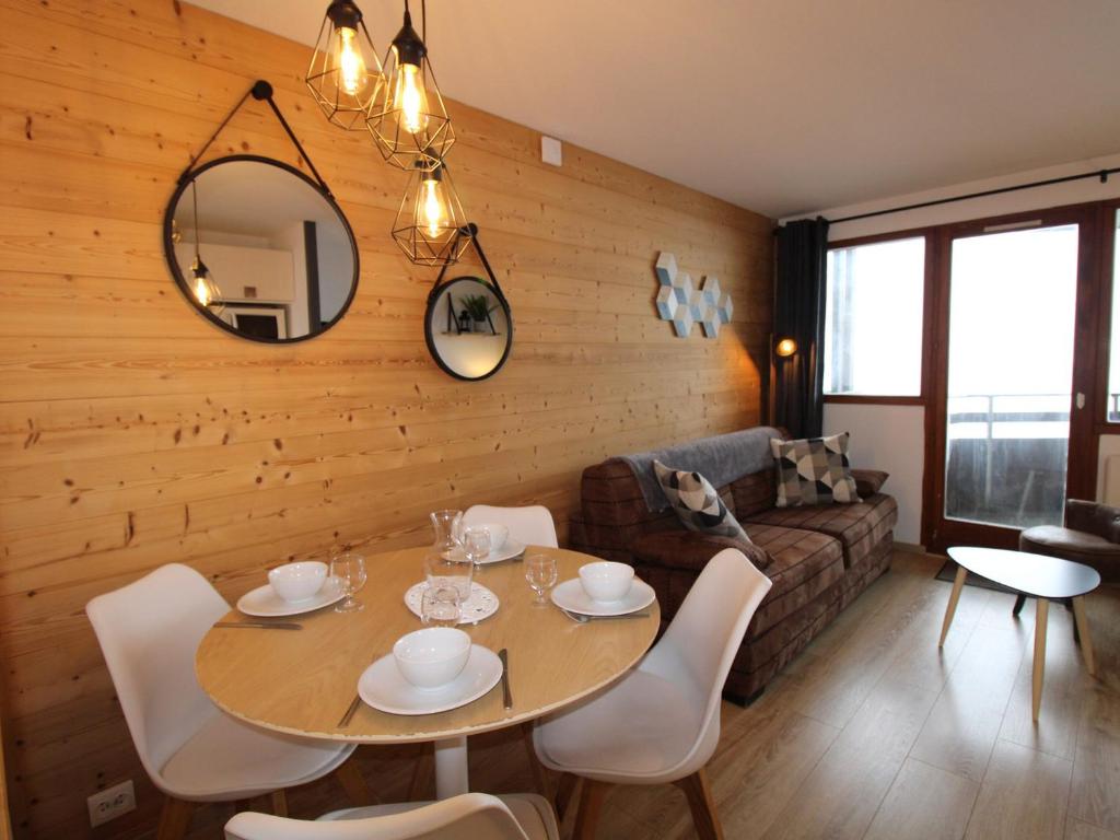 a living room with a table and a couch at Avoriaz: appart rénové 4 pers, proche pistes, WiFi, casier à skis - FR-1-633-32 in Avoriaz