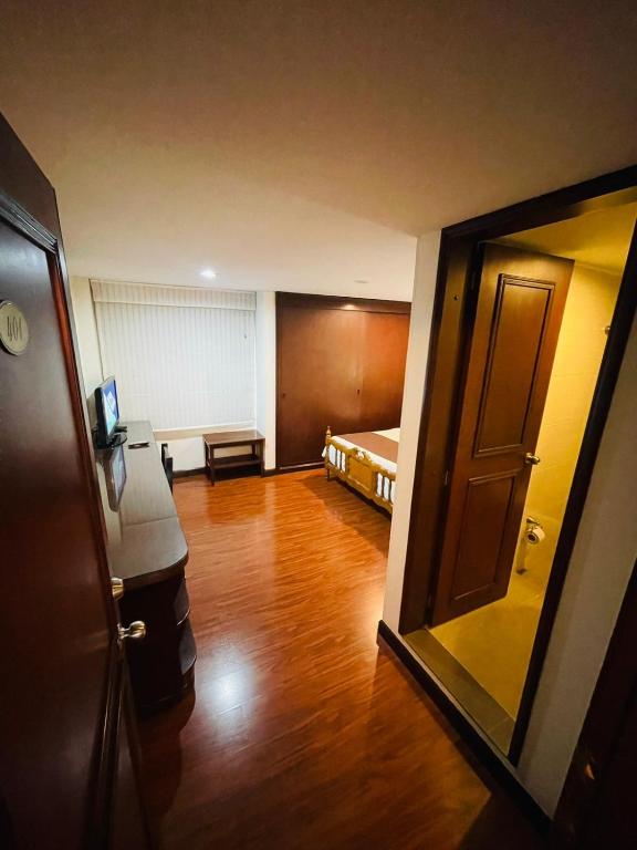 Postel nebo postele na pokoji v ubytování Hotel La Sabana