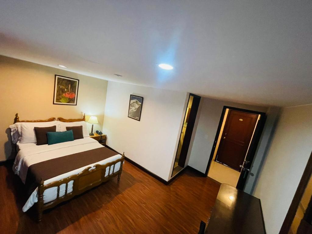 Postel nebo postele na pokoji v ubytování Hotel La Sabana