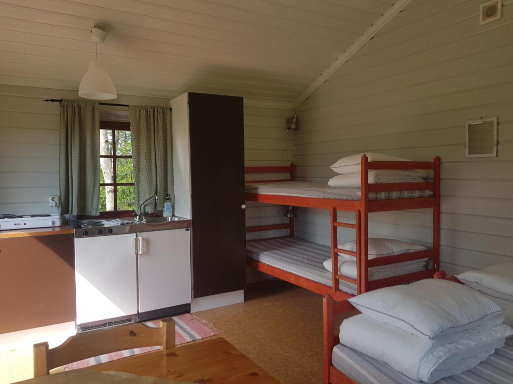 Postel nebo postele na pokoji v ubytování Lufta Camping & Restaurang