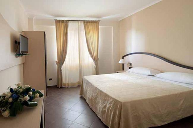 Postel nebo postele na pokoji v ubytování Villa Icidia